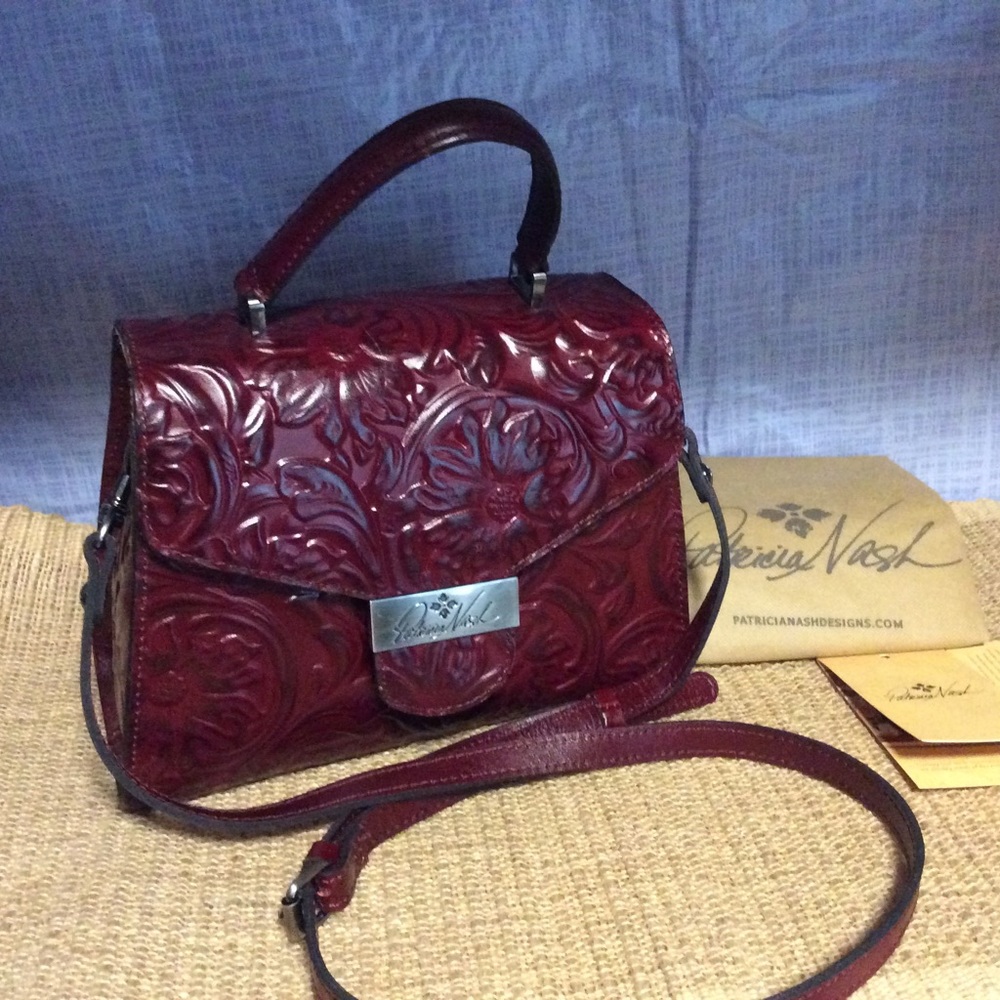 Patricia Nash purse, burgundy, and color and small. Very nice.